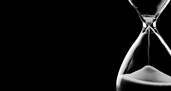 an hourglass on a black background