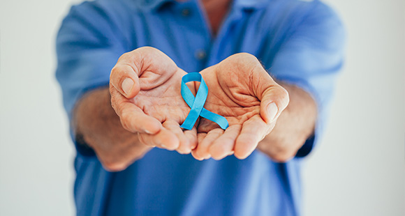 a doctor holding a ribbon symbolising shockwave therapy awareness